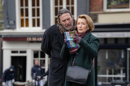 Gerry and Stella looking at a booklet in&nbsp;Midwinter Break (2026).